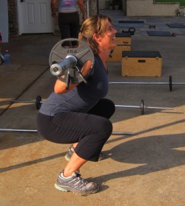 Tracey executes a perfect back squat